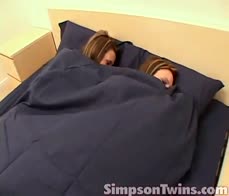 Naughty twins masturbate side by side in bed