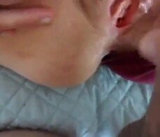 Parting her panties to show hairy pussy and hard clit