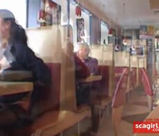 Busty babe flashing in a restaurant