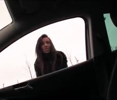 An attractive young brunette gets fucked in a stranger's car 