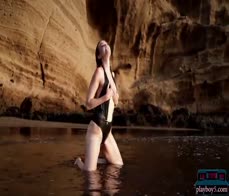 German MILF beauty Jasmin Furry gives a striptease on the beach for Playboy