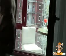 Naughty chick masturbating on the balcony