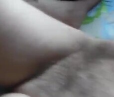 Hairy mature flashing in front of window