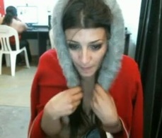 An exhibitionist brunette takes it all off at the internet cafe