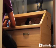 Fucking a redhead behind her working desk