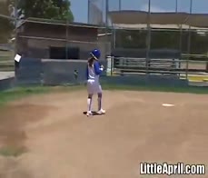 Little April rubs her pussy after baseball