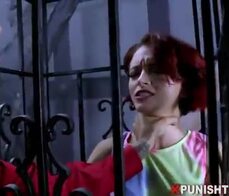 Sexy teen redhead fucked hard through a fetish cage
