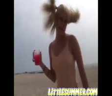 Little Summer fingering her pussy hard at the beach