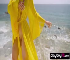 Barely clothed MILF CJ Sparxx reveals her massive boobs at her balcony