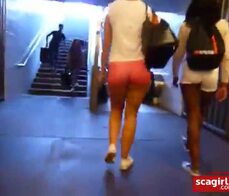 Black & white girl walking, juicy bums in tight pink shorts