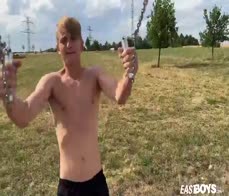 Cute teen blonde boy shows off his abs