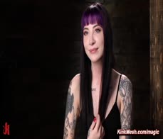 Tattooed slave suspended and flogged in dungeon