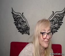 Blonde MILF IngritSno with glasses performs on webcam clothed